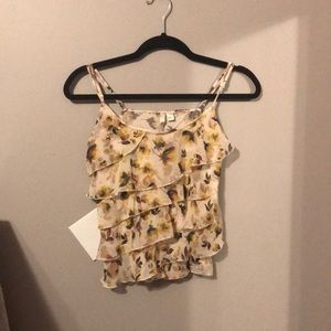 Blouse with yellow flowers on it